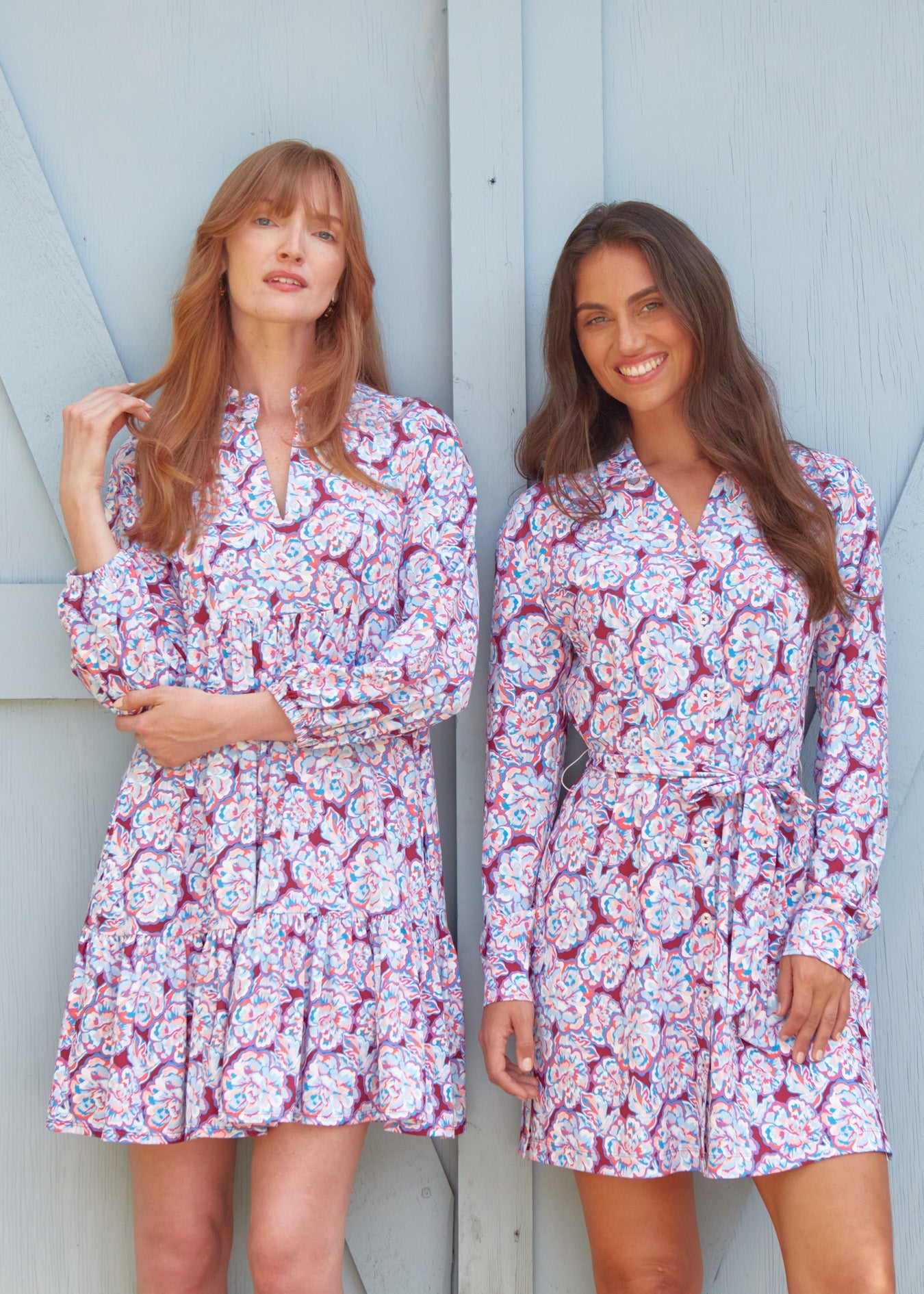 A redhead woman wearing the sun safe Camden Peony Relaxed Dress with a brunette woman wearing the Cabana Life Camden Peony Button Down Shirt Dress.