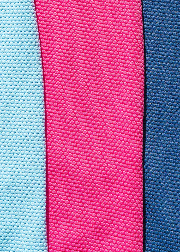 An image showing the Cabana Life dress fabric in pink, aqua and navy. 