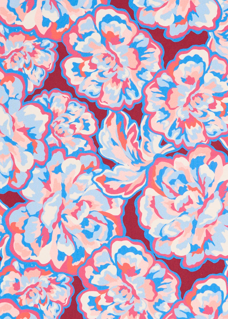 A close up of Cabana Life's pink and blue floral printed Camden Peony on a sun protective fabric.