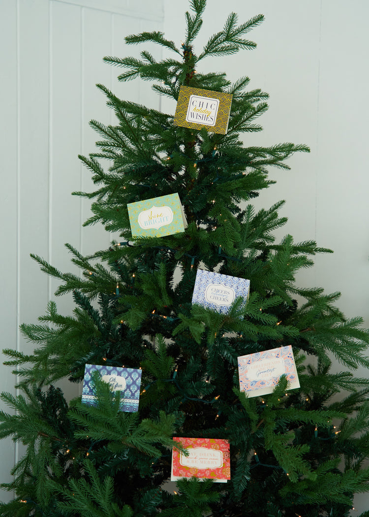 Christmas Tree with Cabana Life Holiday Card Pack on tree