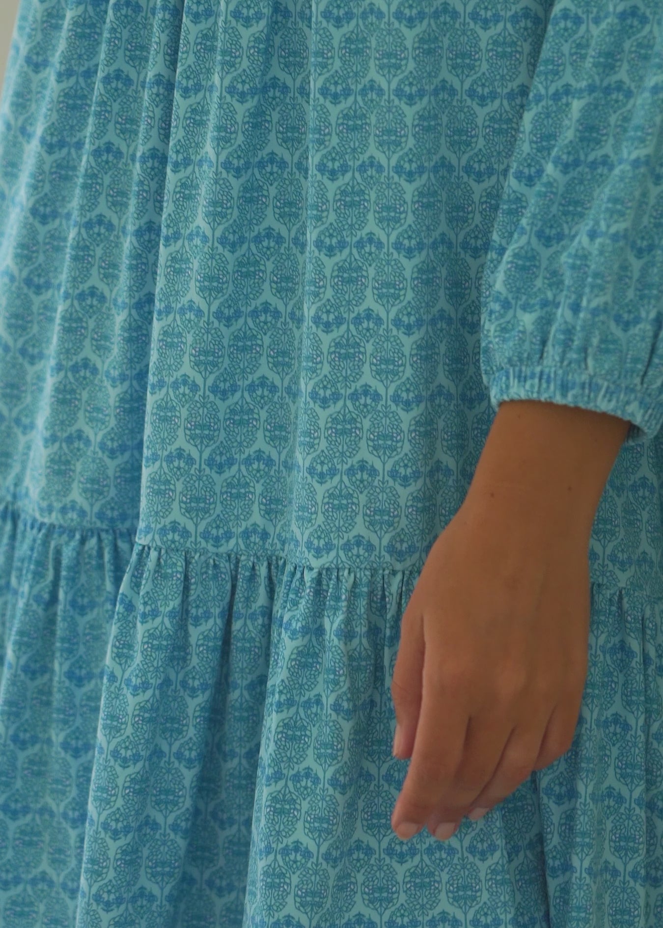 A video of a brunette woman wearing the Cabana Life sun protective Rosebay Relaxed Dress outside.