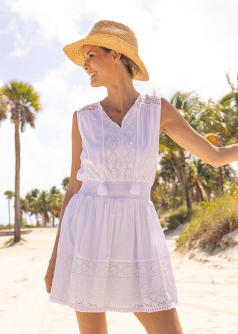 Woman wearing White Eyelet Sleeveless Dress.