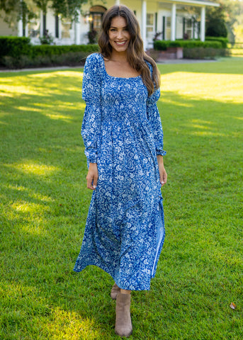 Woman wearing Aspen Puff Sleeve Maxi Dress in grass