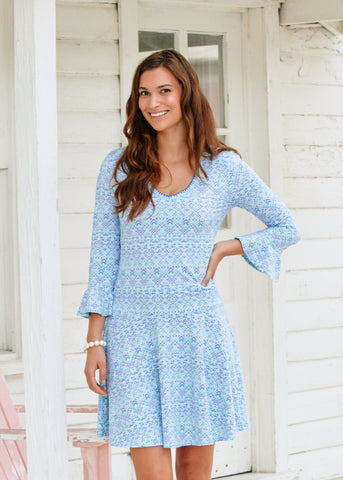 Woman wearing the Naples Embroidered Drop Waist Dress.