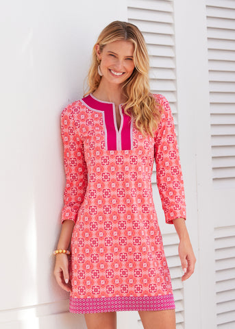 Woman wearing the Coral Gables Embroidered Tunic Dress.