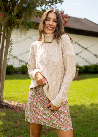 Woman wearing sweater over Jetties Beach Sleeveless Shift Dress.