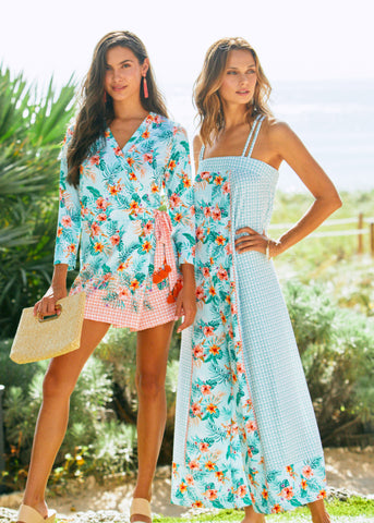 Woman wearing Cabana Life Cayman Wrap Romper and woman wearing Cabana Life Cayman Palazzo Jumpsuit
