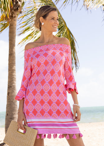 Woman wearing Coral Geo Off The Shoulder Dress.