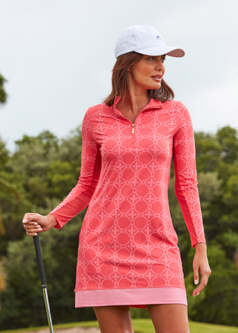 Woman wearing Coral Gables Sport Zip Dress & White Cabana Life Baseball Hat holding golf club