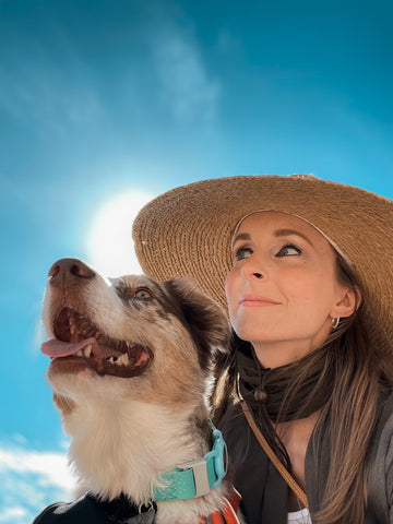 Bleu sky woman with dog