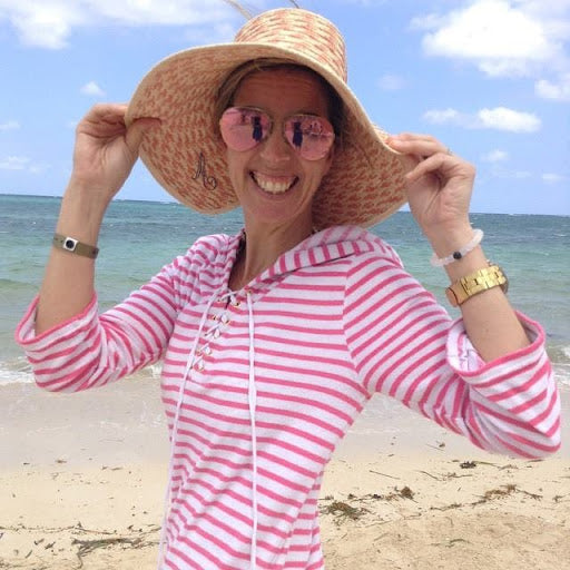 Woman wearing hat and Cabana Life Dress on beach