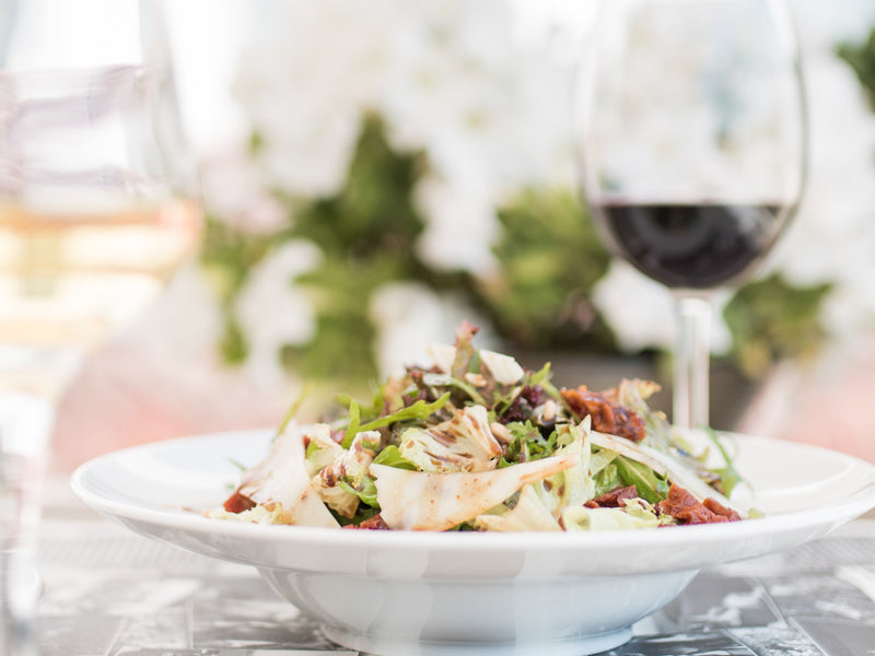 Sala don plate with red wine in wine glass