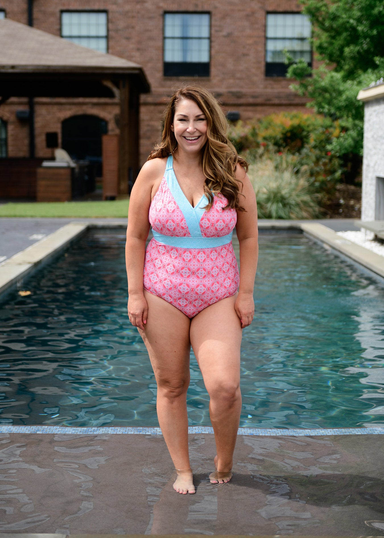 Woman wearing Cabana Life Coral Tides Embroidered One Piece