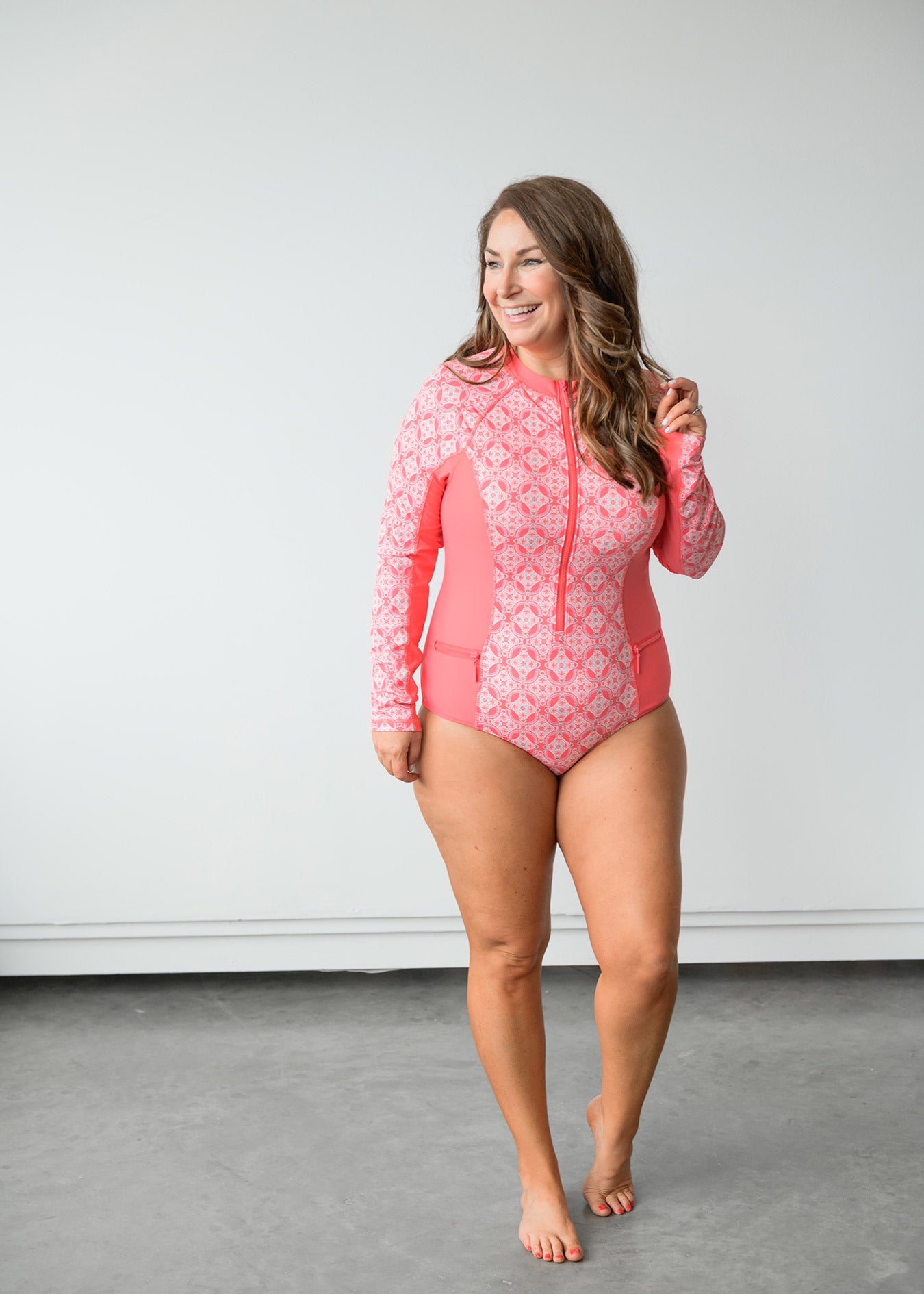 Woman wearing Cabana Life Coral Tides Unisuit UPF 50+