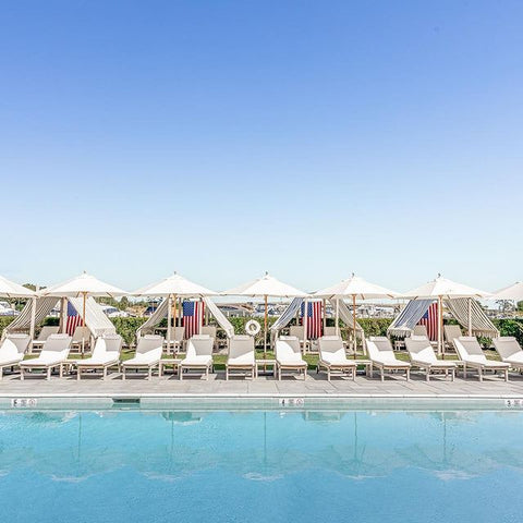 Baron's Cove Poolside and white lounge chairs