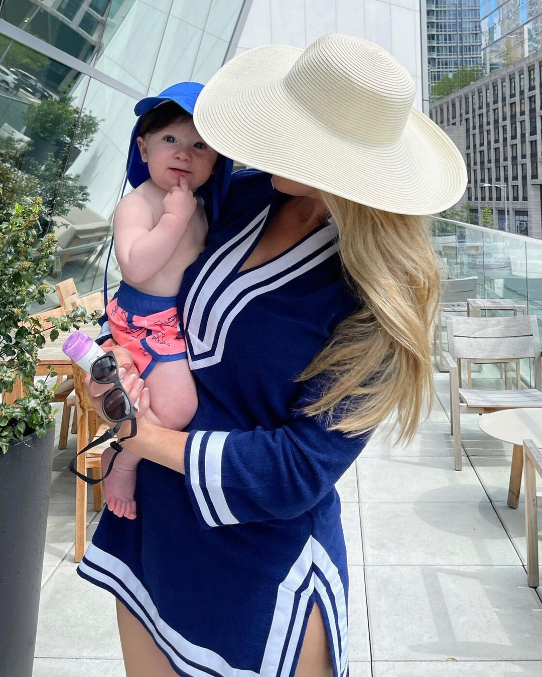 Woman holding baby and wearing Cabana Life Navy/White Terry Tunic