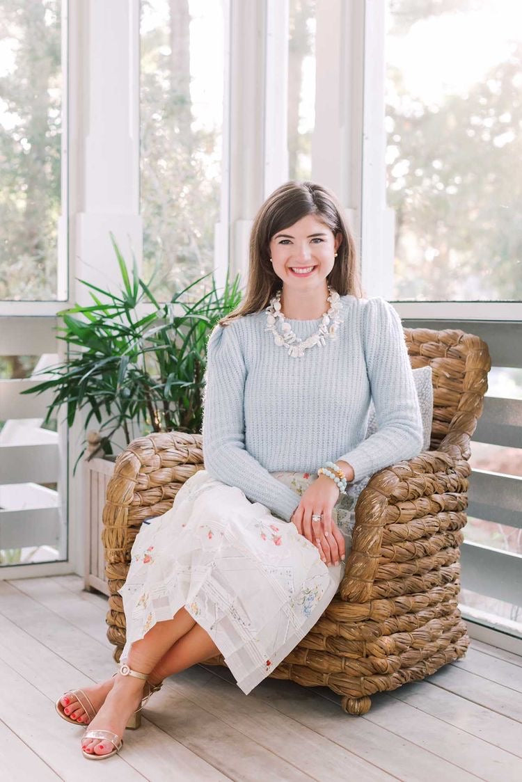 Hazen & Co Founder Taylor sitting on a chair